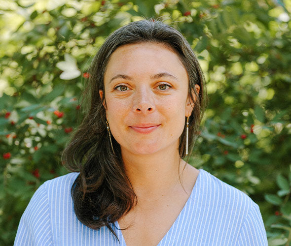 Laura Whitaker, owner and founder of Wildcraft, standing in a park
